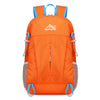 Orange ultra-light foldable travel backpack for hiking, cycling, and daily commutes