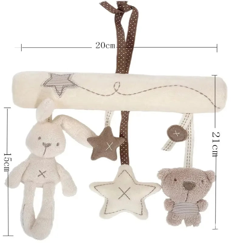 A soft plush bunny rattle toy with a hanging strap and star accents.