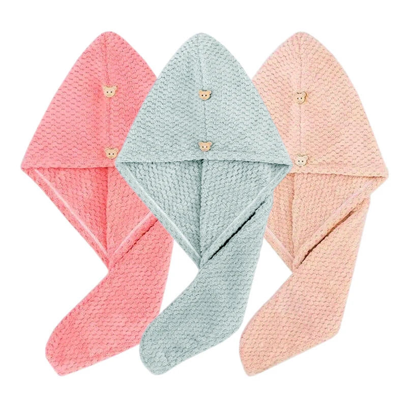 Three folded ultra-soft microfiber hair drying towels in pink, mint green, and peach colors