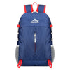 Navy blue ultra-light foldable travel backpack with red accents and mesh pockets