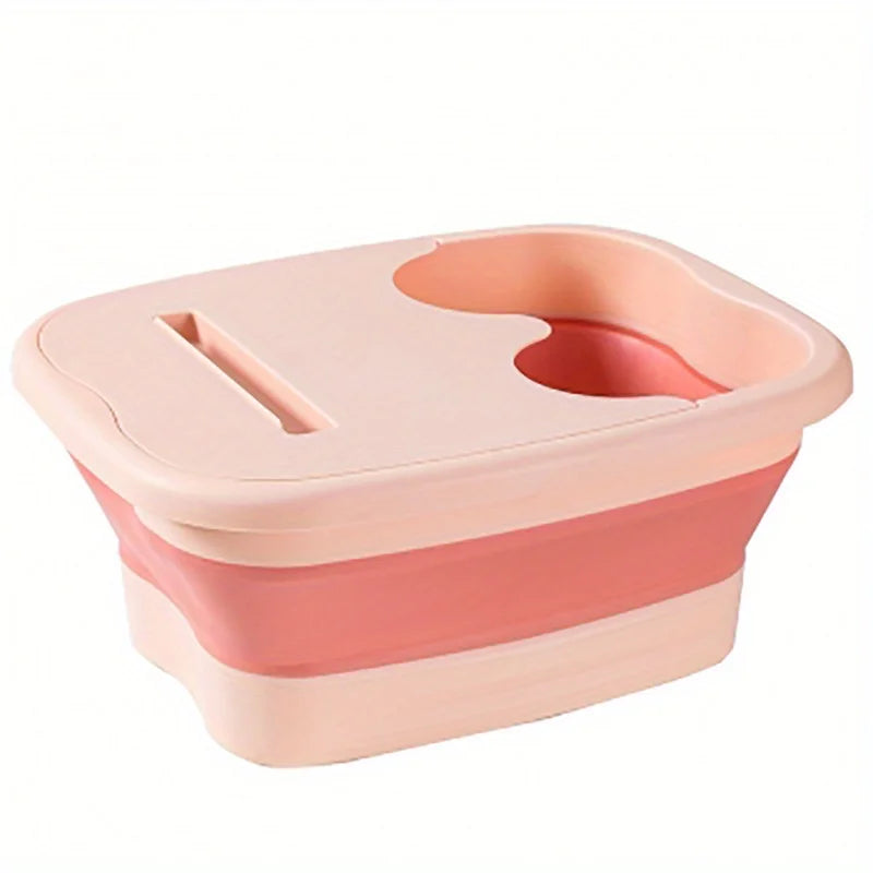 A pink collapsible foot spa bucket with a contoured design and massage nodules.