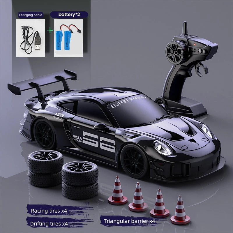 Black Super Racers drift truck model with racing tires and triangular barriers displayed on a gray background.