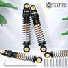 A set of black and gold aluminum shock absorbers for RC crawlers, shown with individual components.