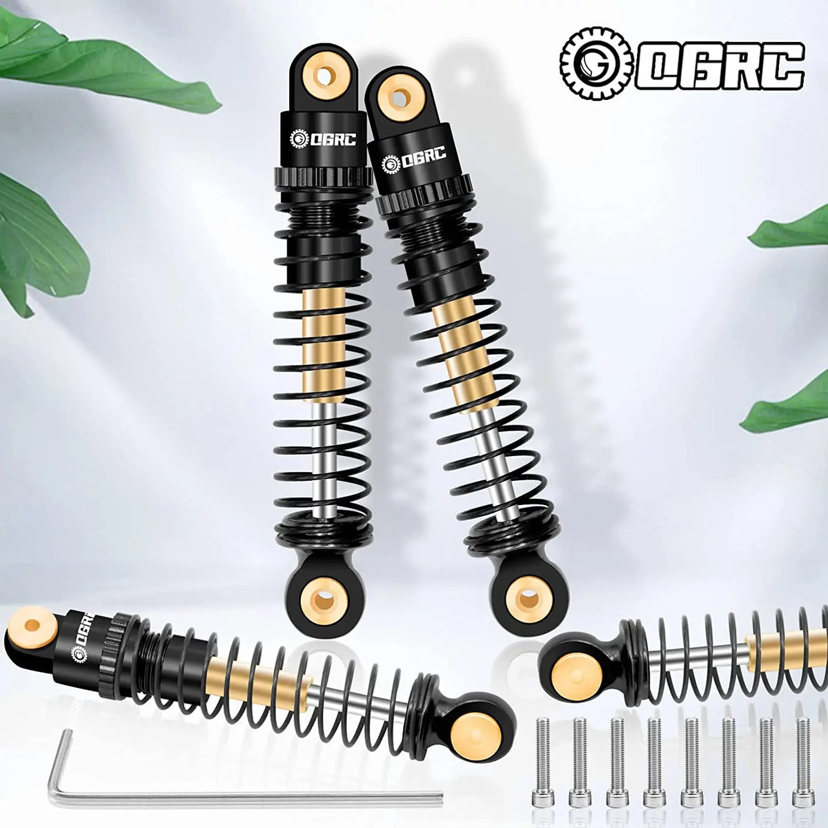 A set of black and gold aluminum shock absorbers for RC crawlers, shown with individual components.