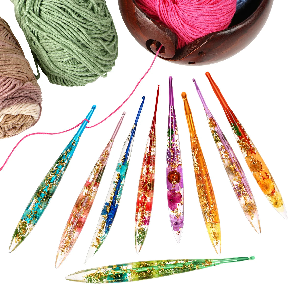 A set of epoxy resin floral-patterned crochet hooks and yarn spools in various colors.