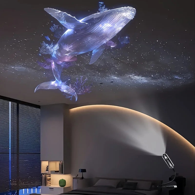 An LED USB projector light displays glowing whale, butterfly, and star patterns on a ceiling.