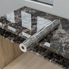 Roll of marble effect self-adhesive PVC film with a geometric pattern placed on a black marble countertop.