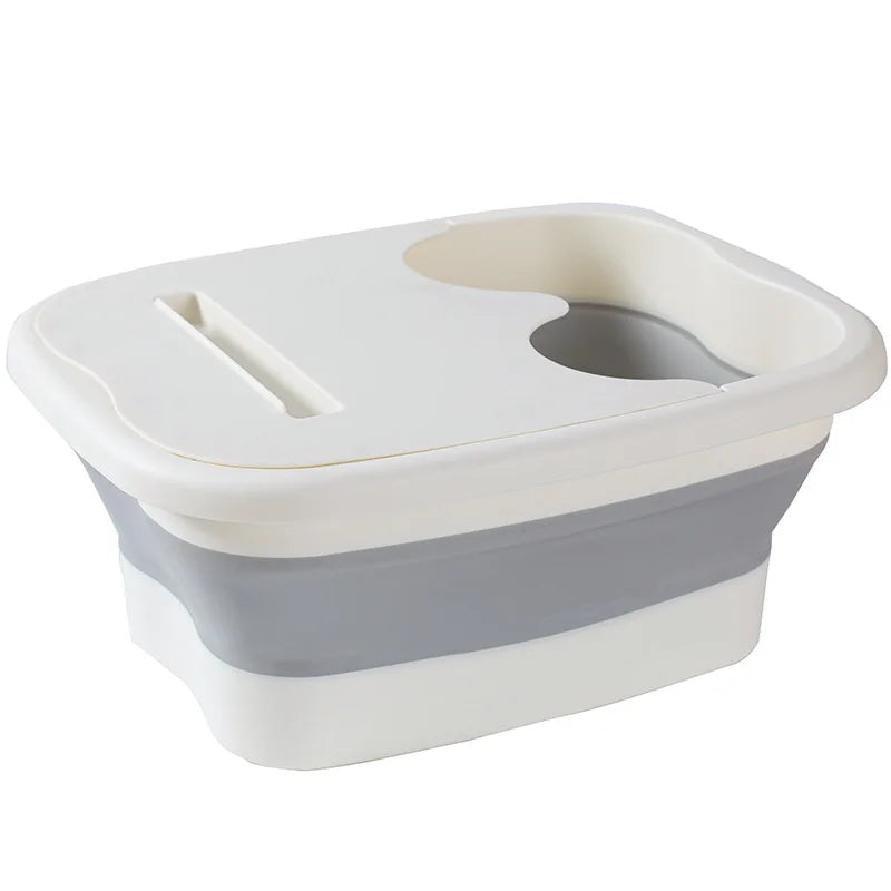 A white and gray collapsible foot spa bucket with a removable insert for massage nodules.
