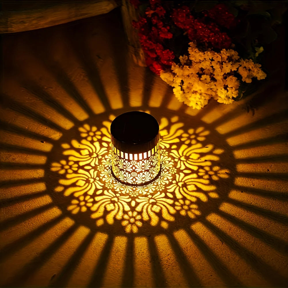 A solar peony wall light casts intricate, radiating shadows on a surface.