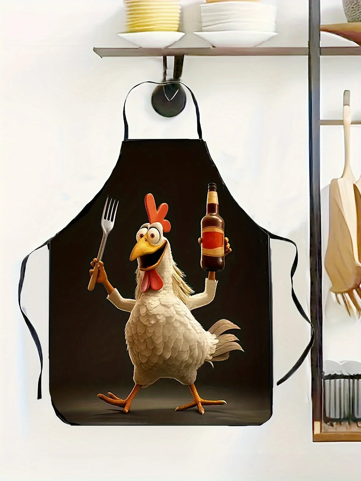A black apron featuring a cartoon rooster character with a red comb holding a bottle.