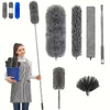 A collection of fluffy microfiber duster heads and a telescopic extension pole for cleaning.