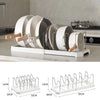 A white expandable pot and pan organizer rack with adjustable dividers shown in a close-up view.