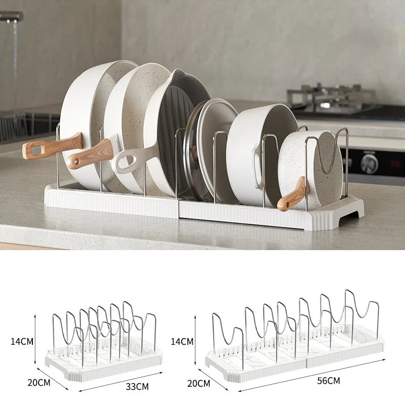 A white expandable pot and pan organizer rack with adjustable dividers shown in a close-up view.