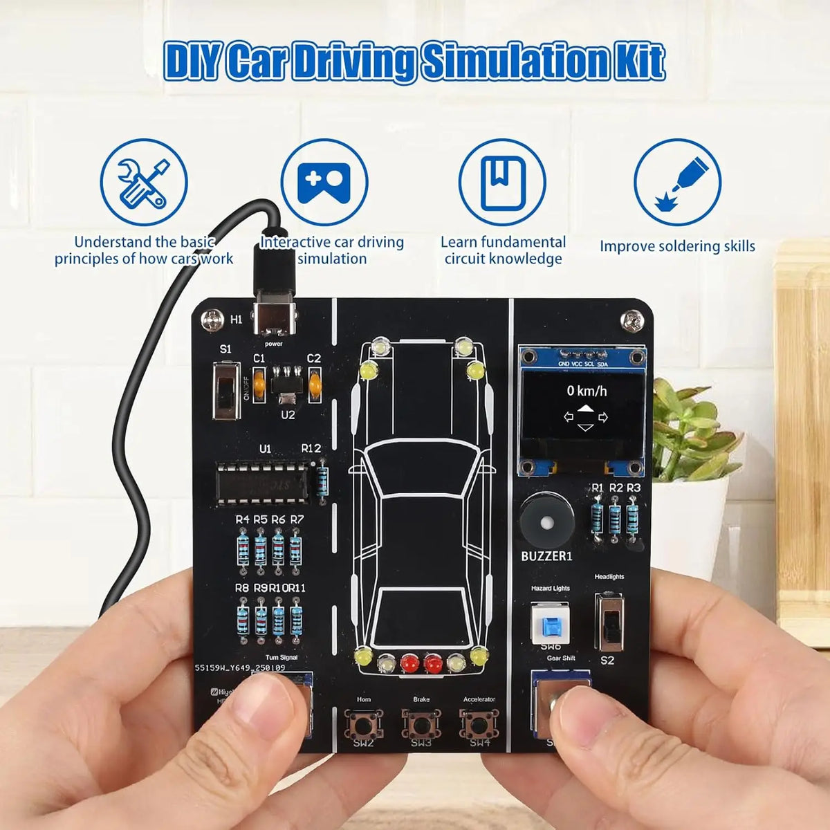 A black DIY car driving simulation circuit board with components and wires is held in a person's hand.