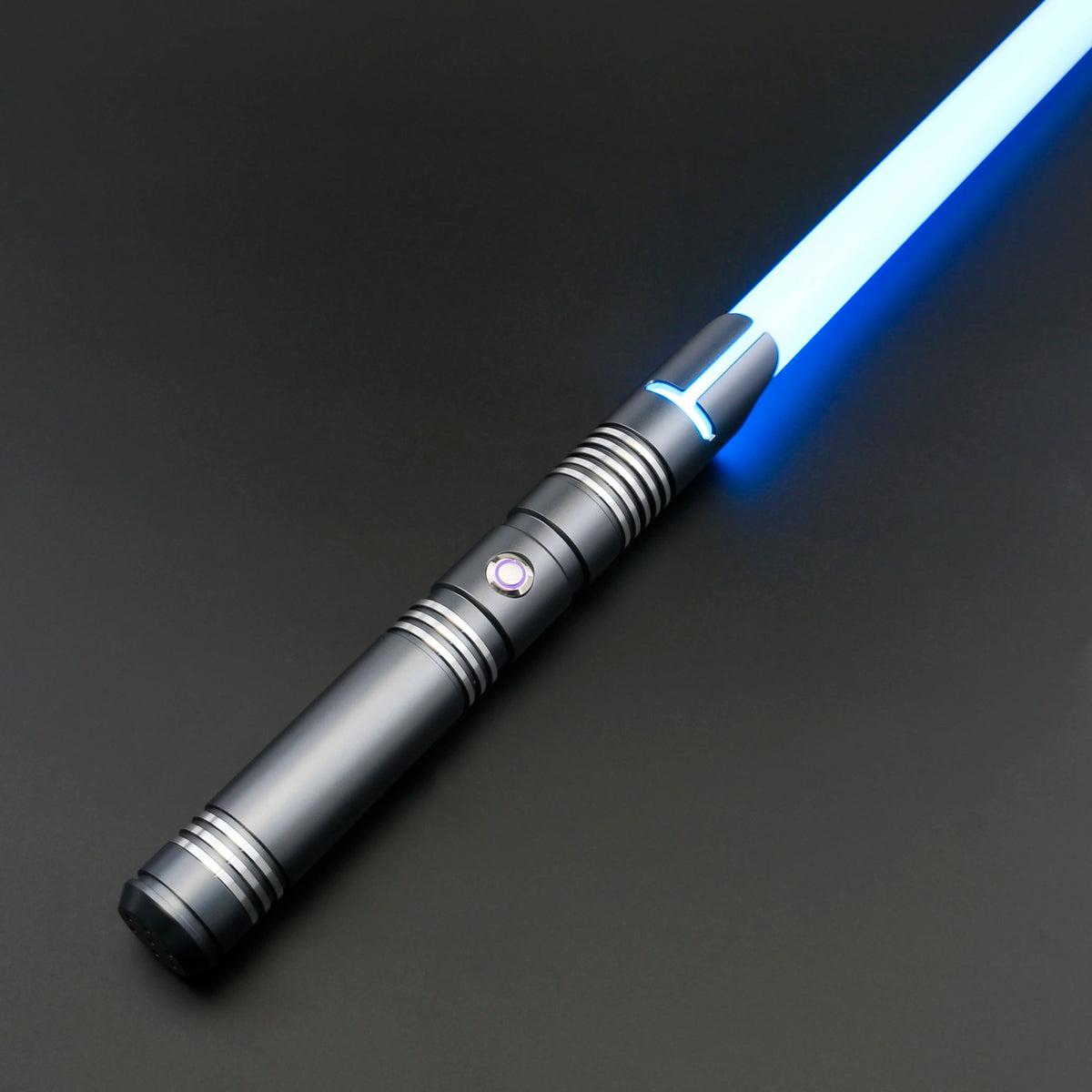 A close-up of a Neo Pixel lightsaber with a glowing blue blade and a black hilt against a dark background.