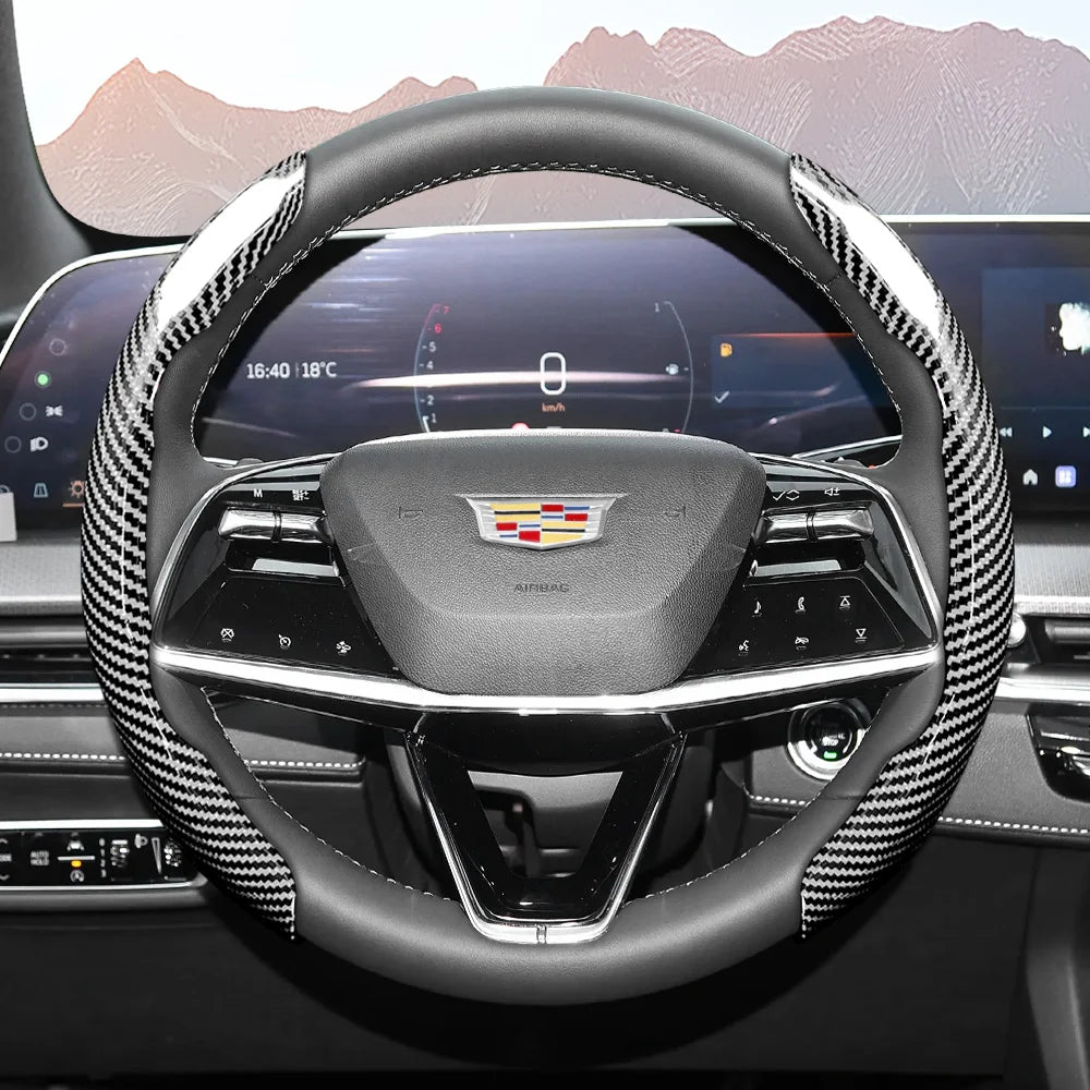 A close-up view of a glossy carbon fiber steering wheel cover inside a car cockpit.