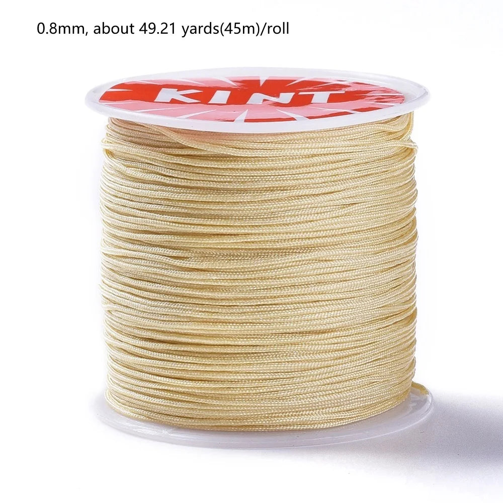 A spool of 0.8mm red nylon cord for jewelry making and crafting.