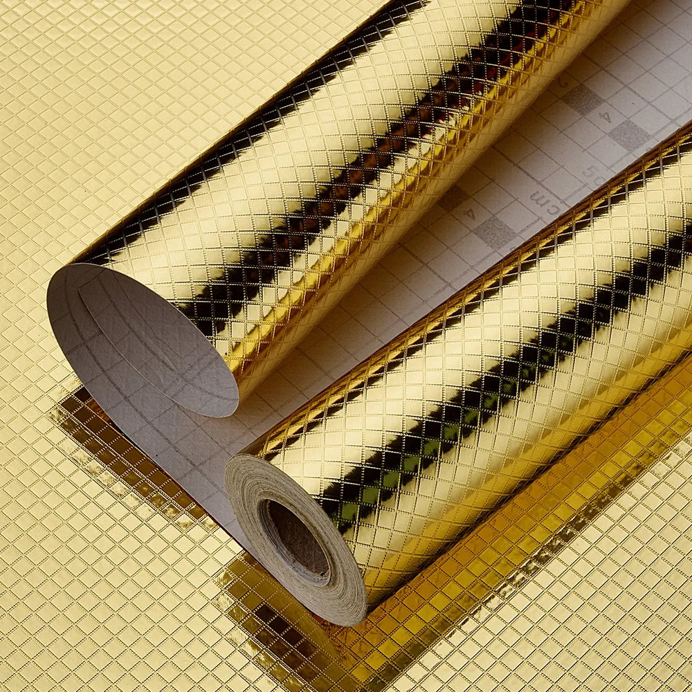 Roll of self-adhesive aluminum foil kitchen wall stickers showing a textured, gold-colored surface.