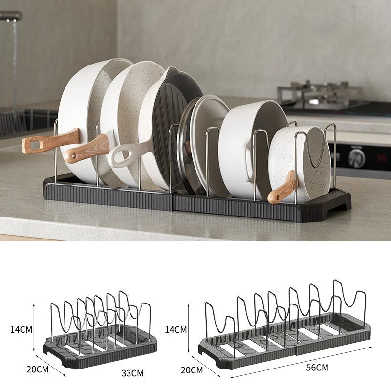 A black organizer rack holds multiple white and gray lids for pots and pans.