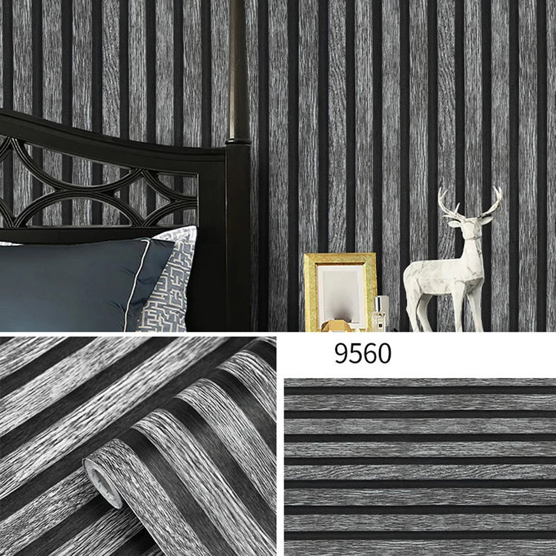 A roll of striped peel-and-stick wallpaper featuring dark gray and black vertical stripes.