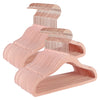 A set of pink velvet hangers with 360 degree swivel hooks for clothing.