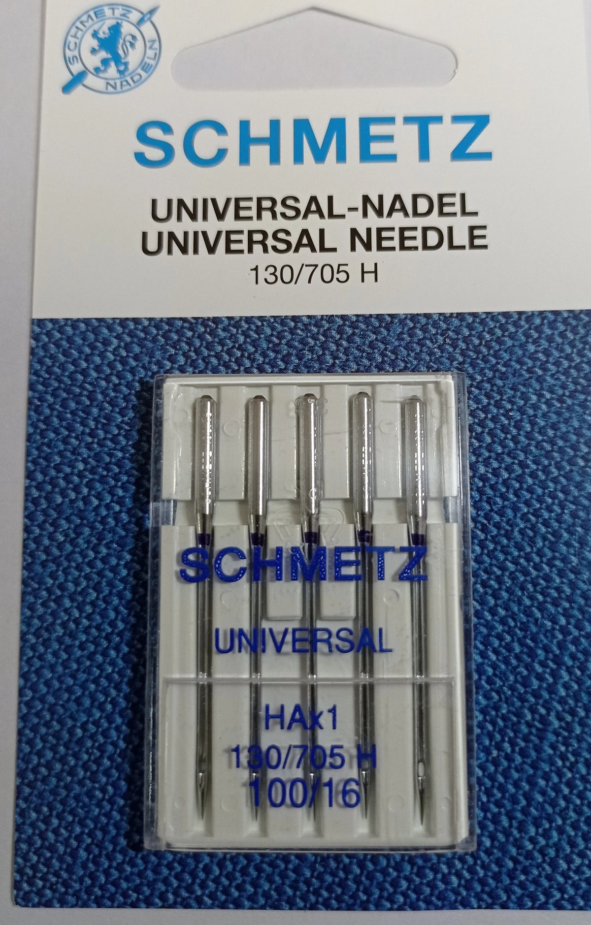 A package of five SCHMETZ universal sewing machine needles labeled 130/705 H and 100/16.