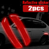 Two red reflective sticker strips are shown on a silver car body in a dark setting.