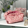 Neceser acolchado con estampado floral y lazo decorativo
