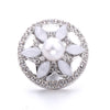 Silver metal snap buttons for jewelry making featuring a central pearl surrounded by flower-shaped clear stones