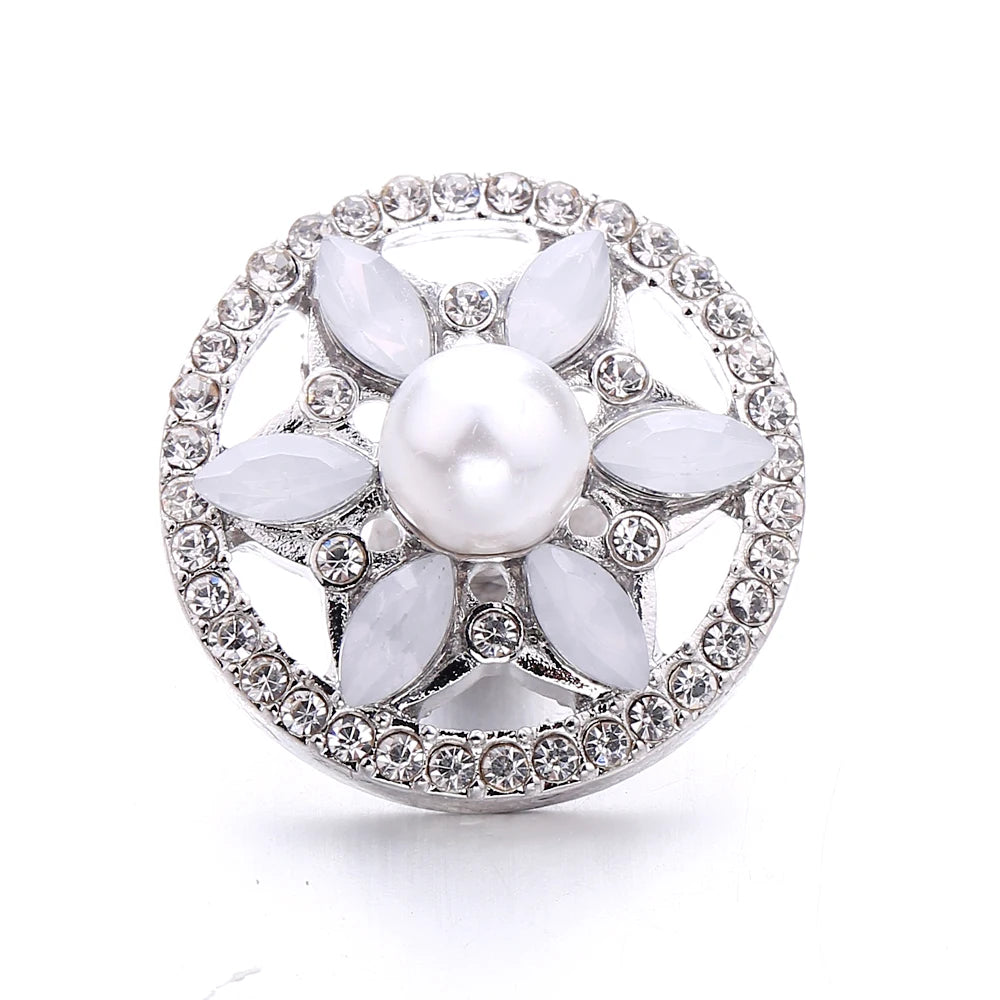 Silver metal snap buttons for jewelry making featuring a central pearl surrounded by flower-shaped clear stones