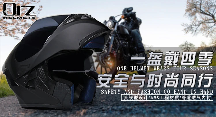 A black modular flip-up motorcycle helmet is shown next to a motorcycle in an outdoor setting.