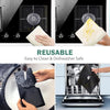 Reusable non-stick gas stove protector mats being used to clean and protect a stovetop.