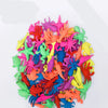 A colorful pile of magical water-growing ocean animal toys for kids featuring various brightly colored sea creatures.