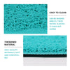 Close-up of a teal cat litter mat with a paw print design showing its mesh texture and thickness.