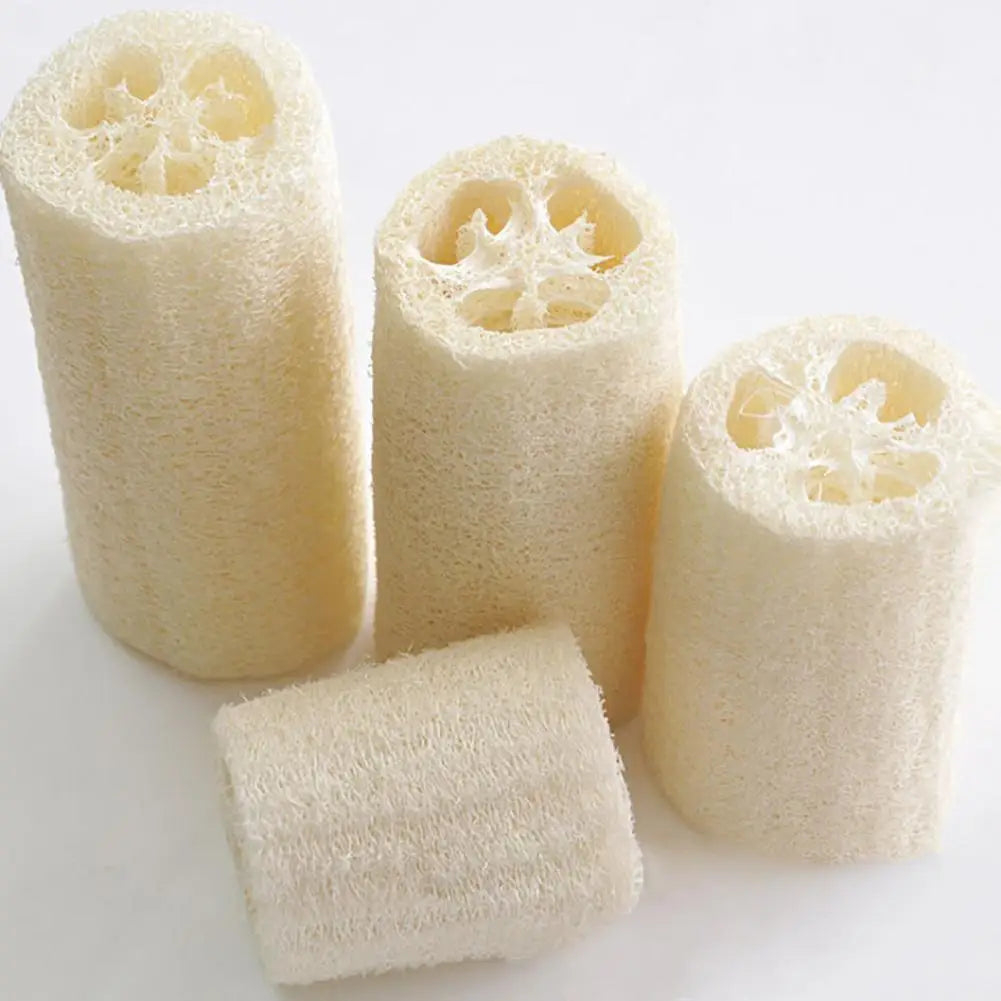 A set of six natural loofah scrubber sponges in light beige color, shown from the side.