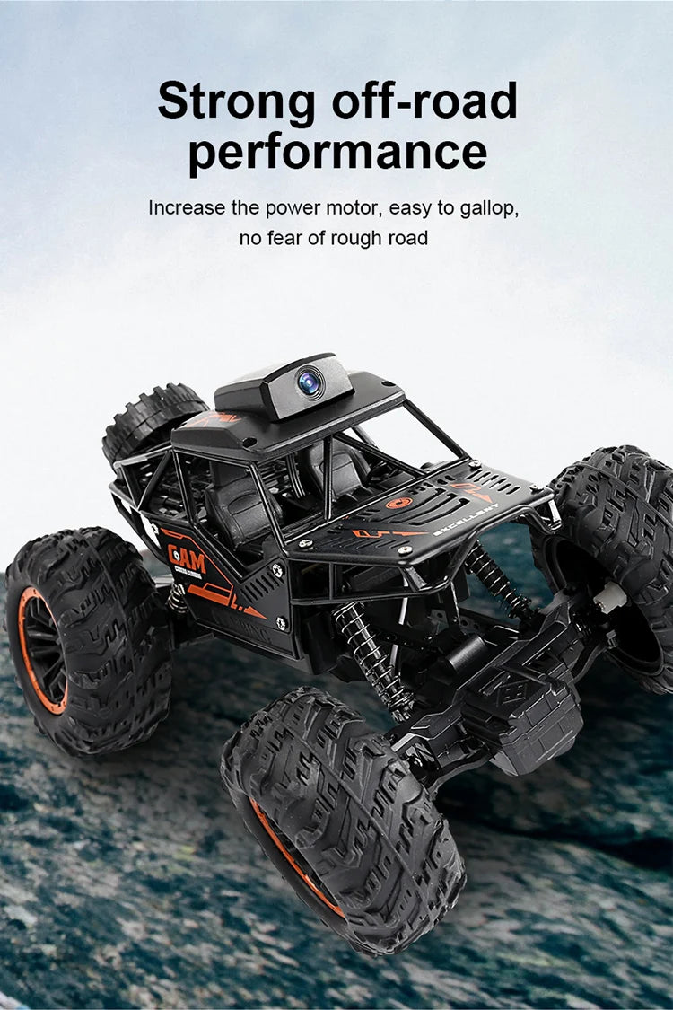 A black 1:18 RC off-road SUV with large tires and an HD FPV camera is shown on a rocky surface.