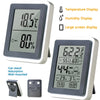 A compact digital thermometer and hygrometer with a large screen display and magnetic mount accessories.