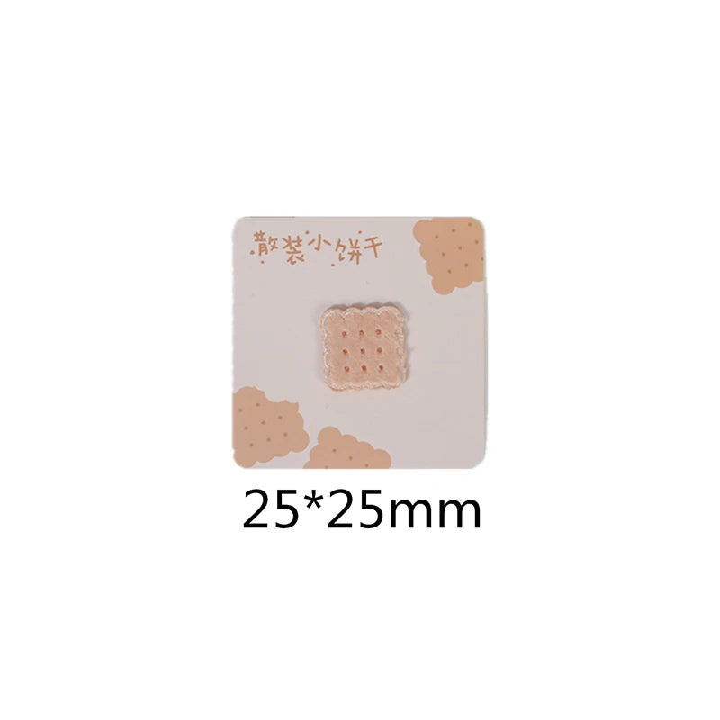 A square iron-on patch featuring a light pink, textured design resembling a piece of toast or bread.