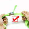 A hand is shown fastening a bright green heavy-duty tie-down strap with a metal buckle.