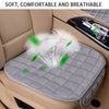 A gray plush car seat cover with a quilted pattern is shown placed in a car seat, emphasizing its soft and breathable feature