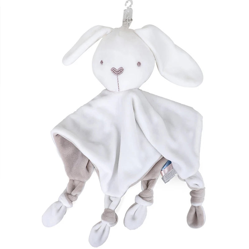 A white sensory elephant plush toy with long ears and a draped blanket.