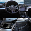 Close-up view of a car interior showing silver plating on trim strips and dashboard components.