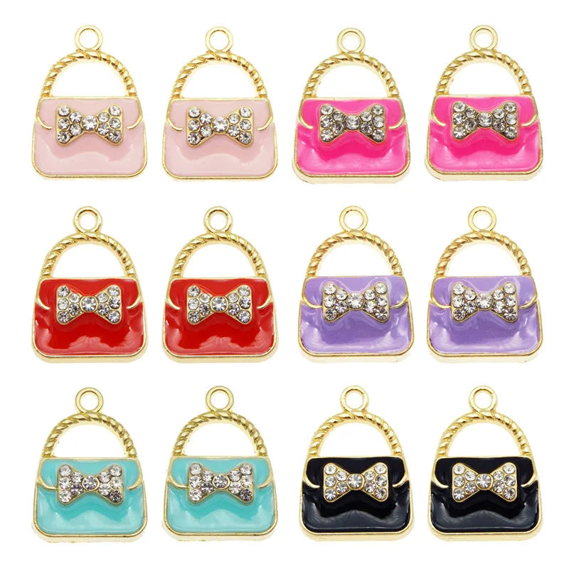 A set of six crystal enamel handbag charm pendants in various colors including pink, red, purple, and black.