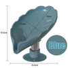 A blue leaf-shaped suction cup soap dish with a self-draining tray and a circular base.