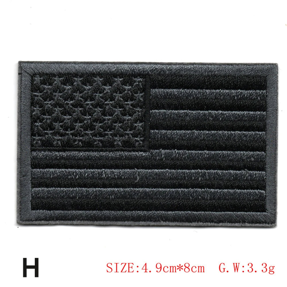 Black embroidered American flag patch with horizontal stripes and a star field.