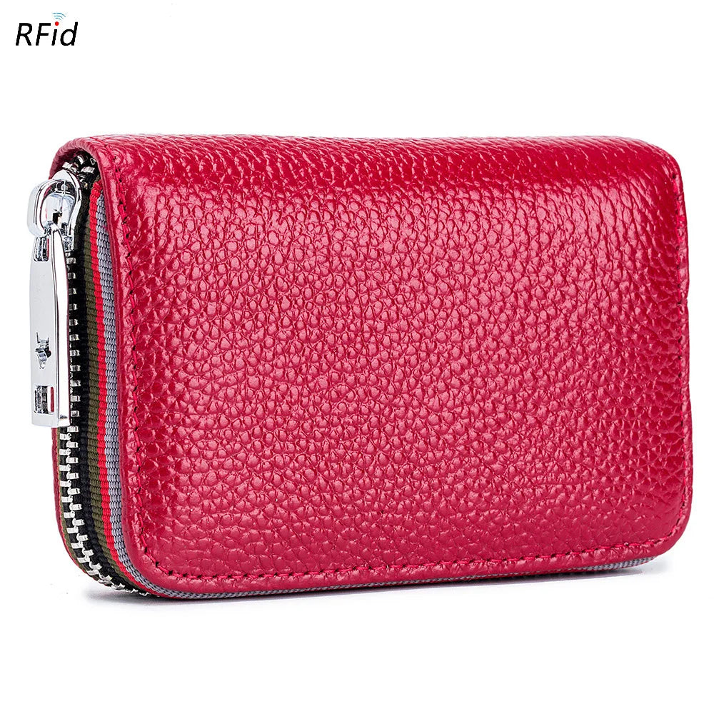 A vibrant red genuine leather card holder with a zipper and RFID protection feature.