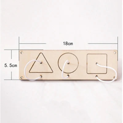 A wooden busy board with three cutout shapes—a triangle, a circle, and a square—for fine motor skill practice.