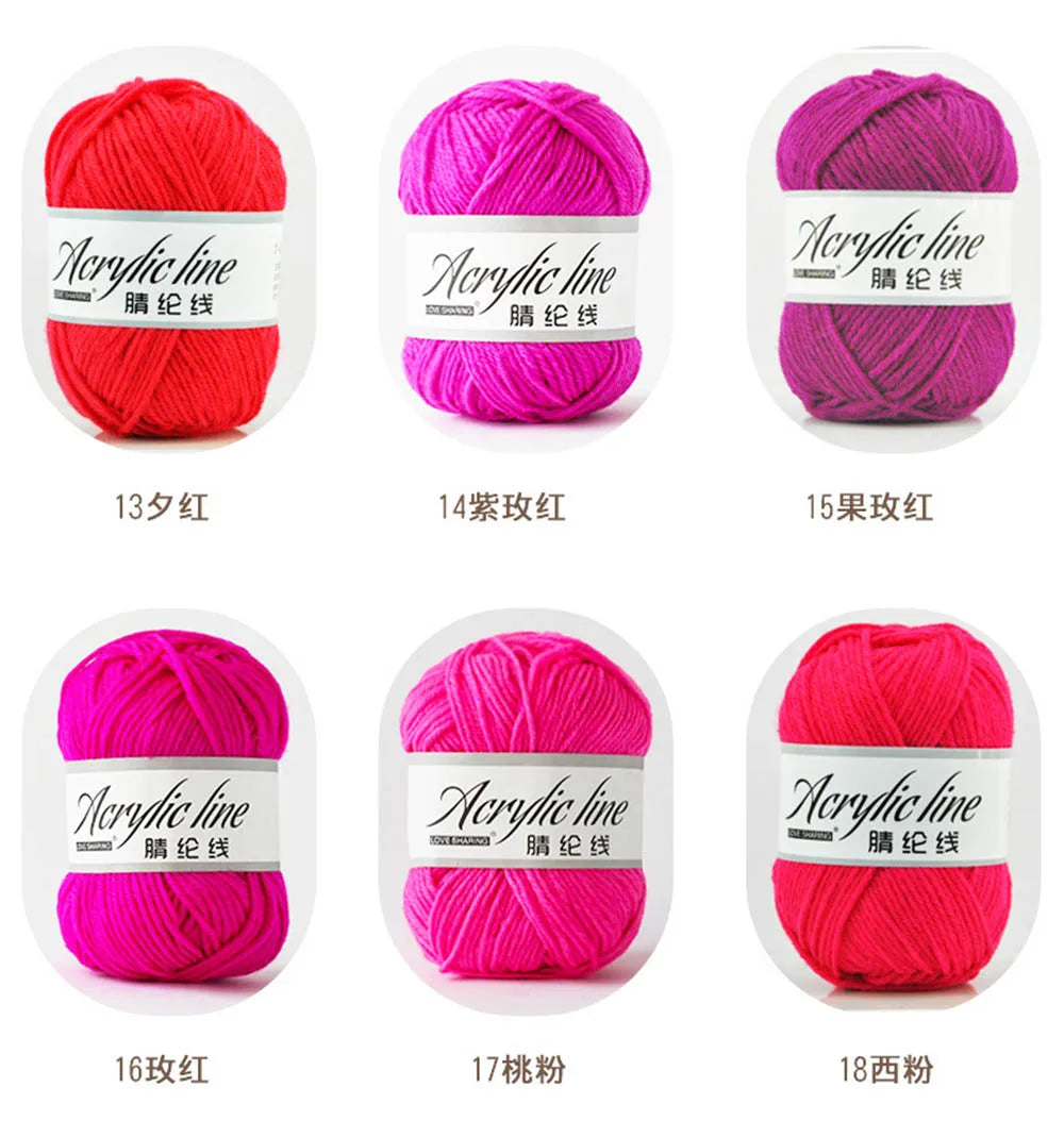 A collection of soft acrylic line yarn balls in various shades of pink and red, labeled by thread count.
