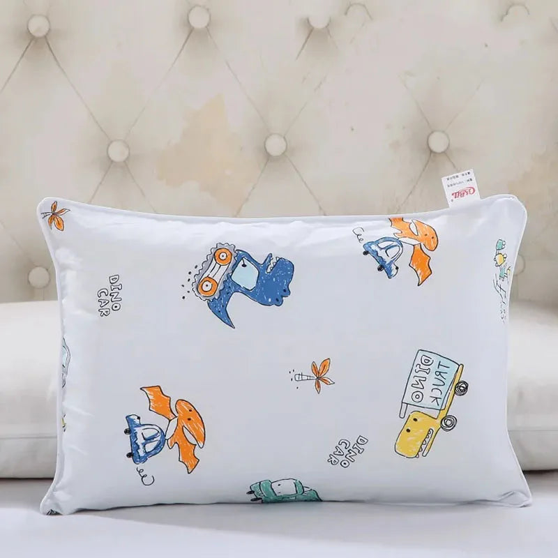 A white cartoon pillow featuring various vehicles and animals on a soft cotton pillowcase.