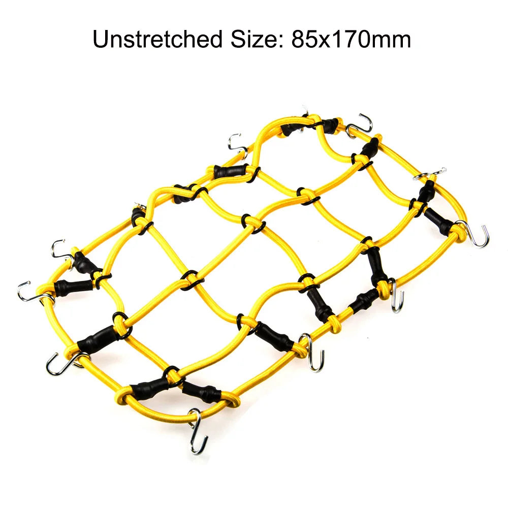 Yellow wire mesh decoration set for RC crawlers including a shovel, fire extinguisher, and oil drum